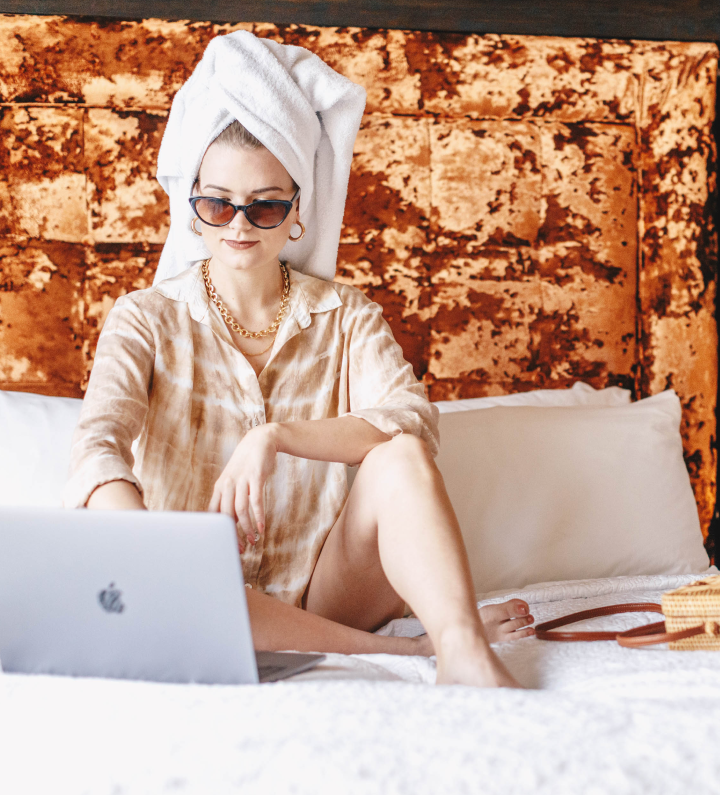 Woman in bed with laptop